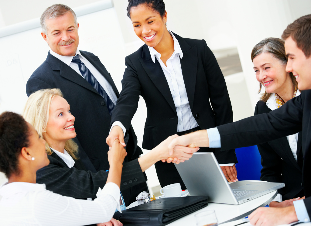 Image showing business people shaking hands at a meeting